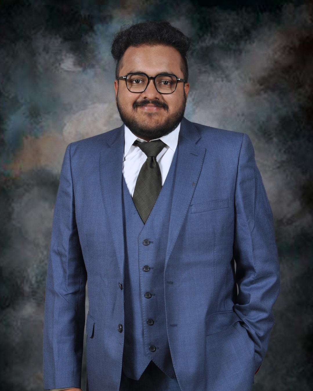 Portrait of Ganesh Datta in a blue suit